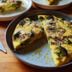 A slice of broccoli and bacon frittata in a pan, part of 25 Genius Egg Recipes.