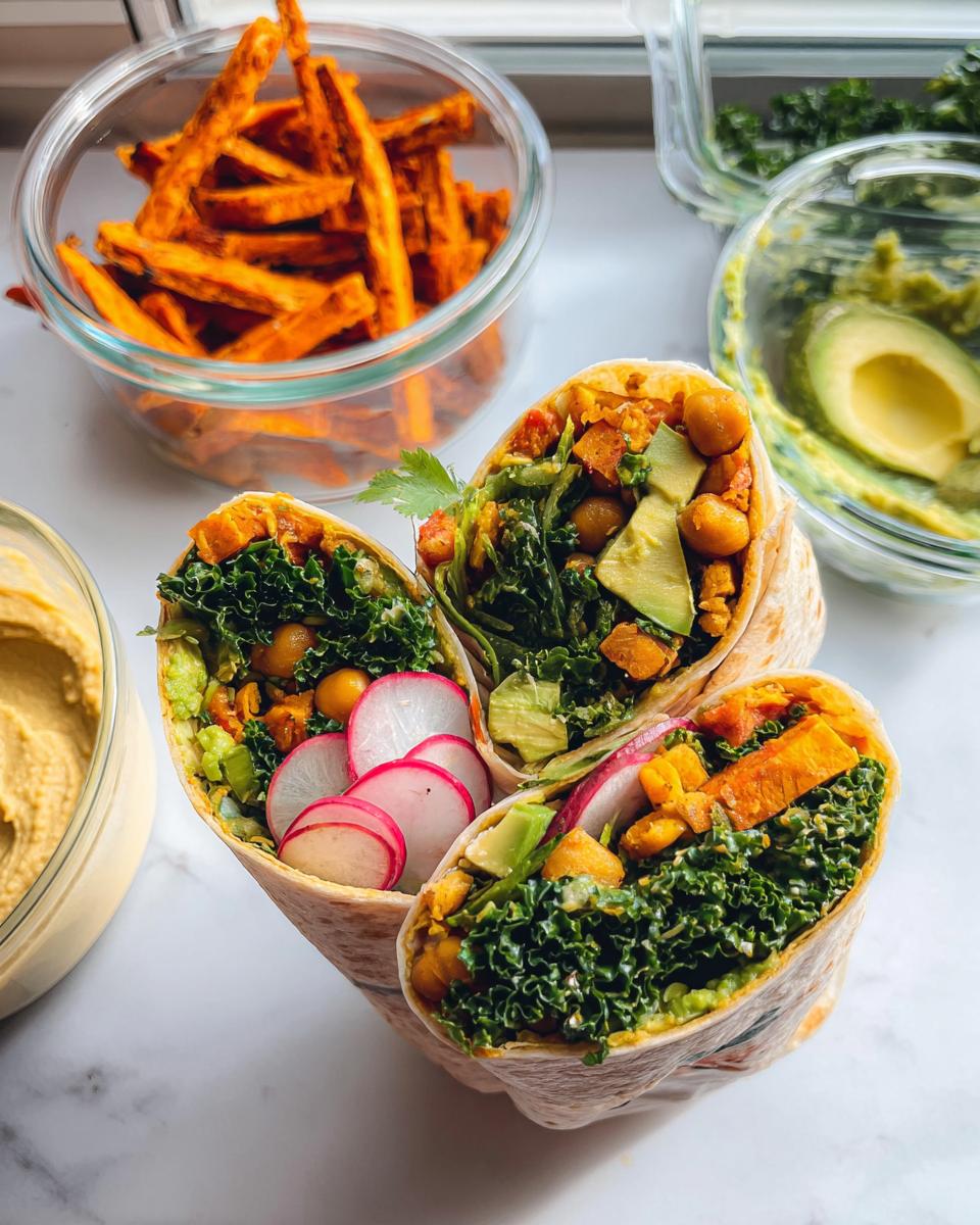 Three healthy wraps filled with kale, chickpeas, avocado, radishes, and sweet potato, perfect for sandwich ideas recipes meal prep.