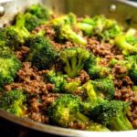 Close-up of a Keto Hamburger Broccoli Skillet, showing seasoned ground beef mixed with vibrant green broccoli florets in a pan.