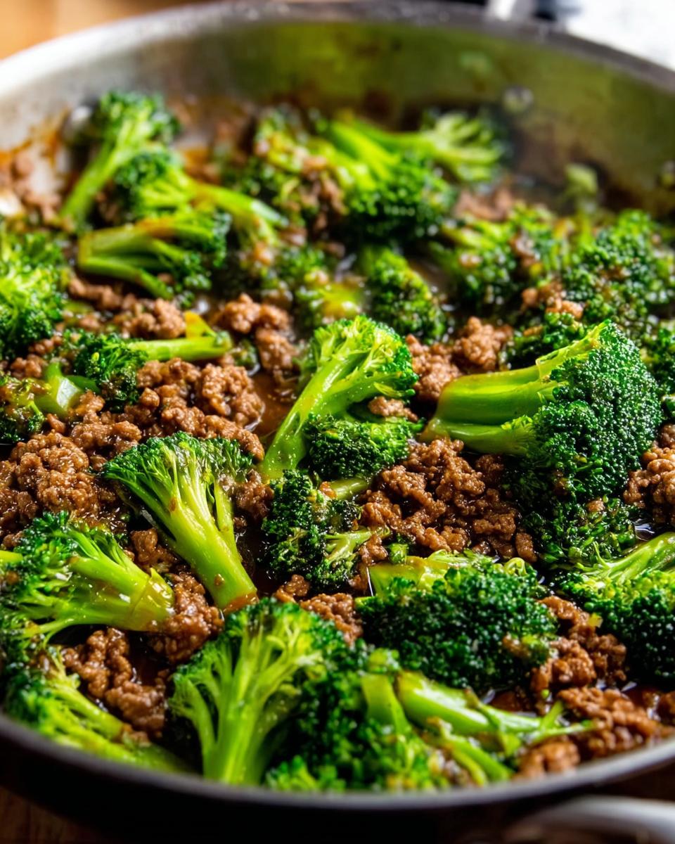 Close-up of a Keto Hamburger Broccoli Skillet with seasoned ground beef and vibrant broccoli florets in a savory sauce.
