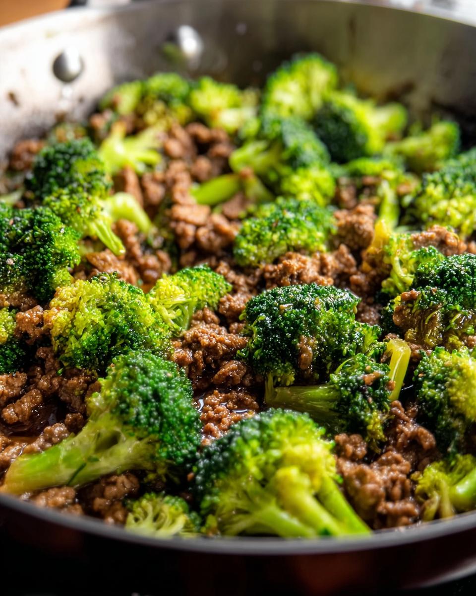 Close-up of a Keto Hamburger Broccoli Skillet, showing seasoned ground beef mixed with tender broccoli florets in a pan.