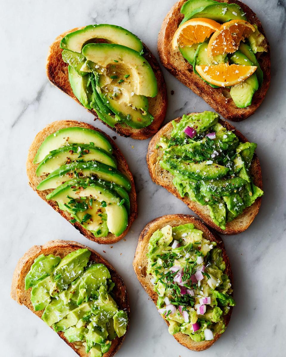 A variety of avocado toast toppings including sliced avocado, mashed avocado with red onion, and avocado with orange slices.