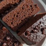 Close-up of moist Greek Yogurt Brownies slices topped with melted chocolate chips.